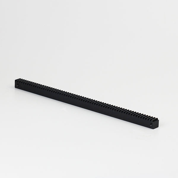 Carbon steel rail for stop motion winder